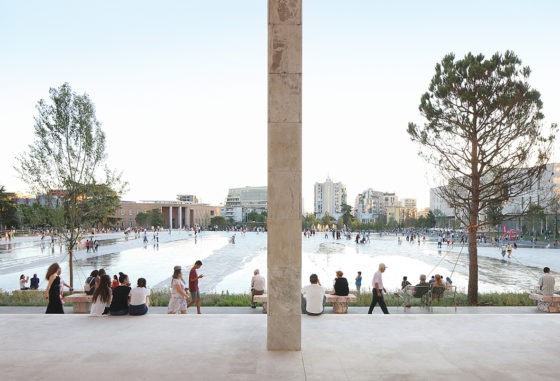 The Skanderbeg Square in Tirana, Albania: a pedestrian square, slightly raised towards the center, surrounded by an urban forest (project by 51N4E, Anri Sala, Plant en Houtgoed, iRI, picture by Filip Dujardin)